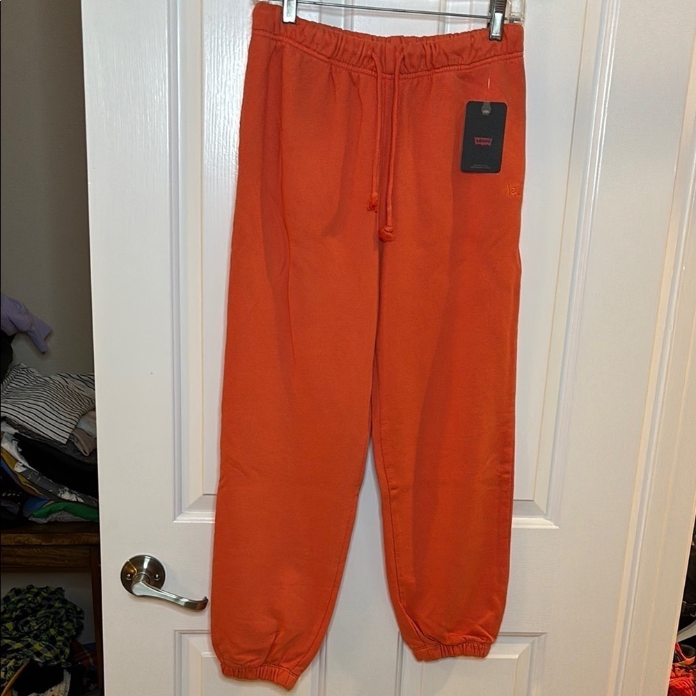 NWT LEVI’s women’s Orange Jogger Sweatpants size small 100% cotton